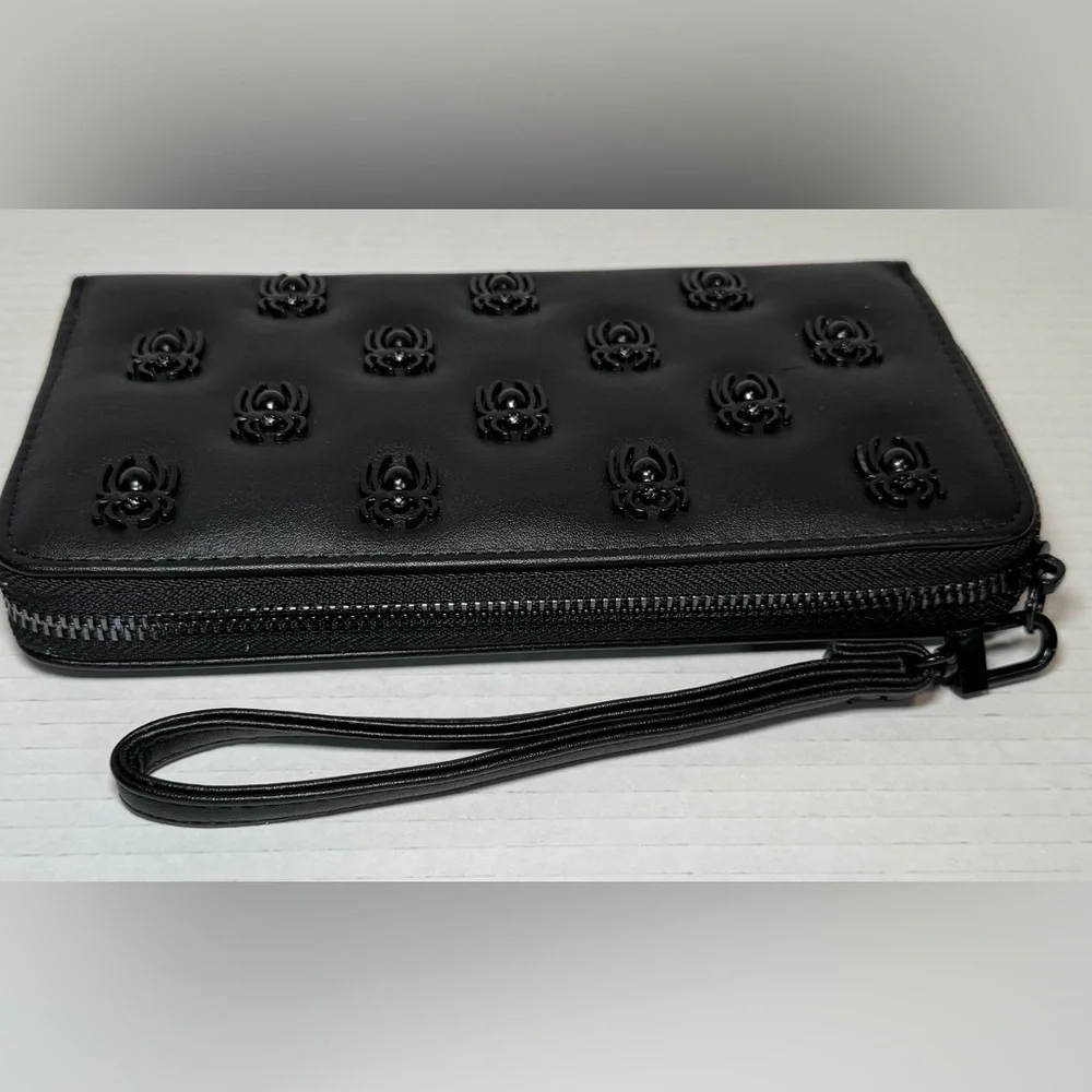 Betsey Johnson black faux leather zip-around wristlet/wallet